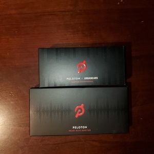 Brand new Peloton ear buds and heart rate monitor